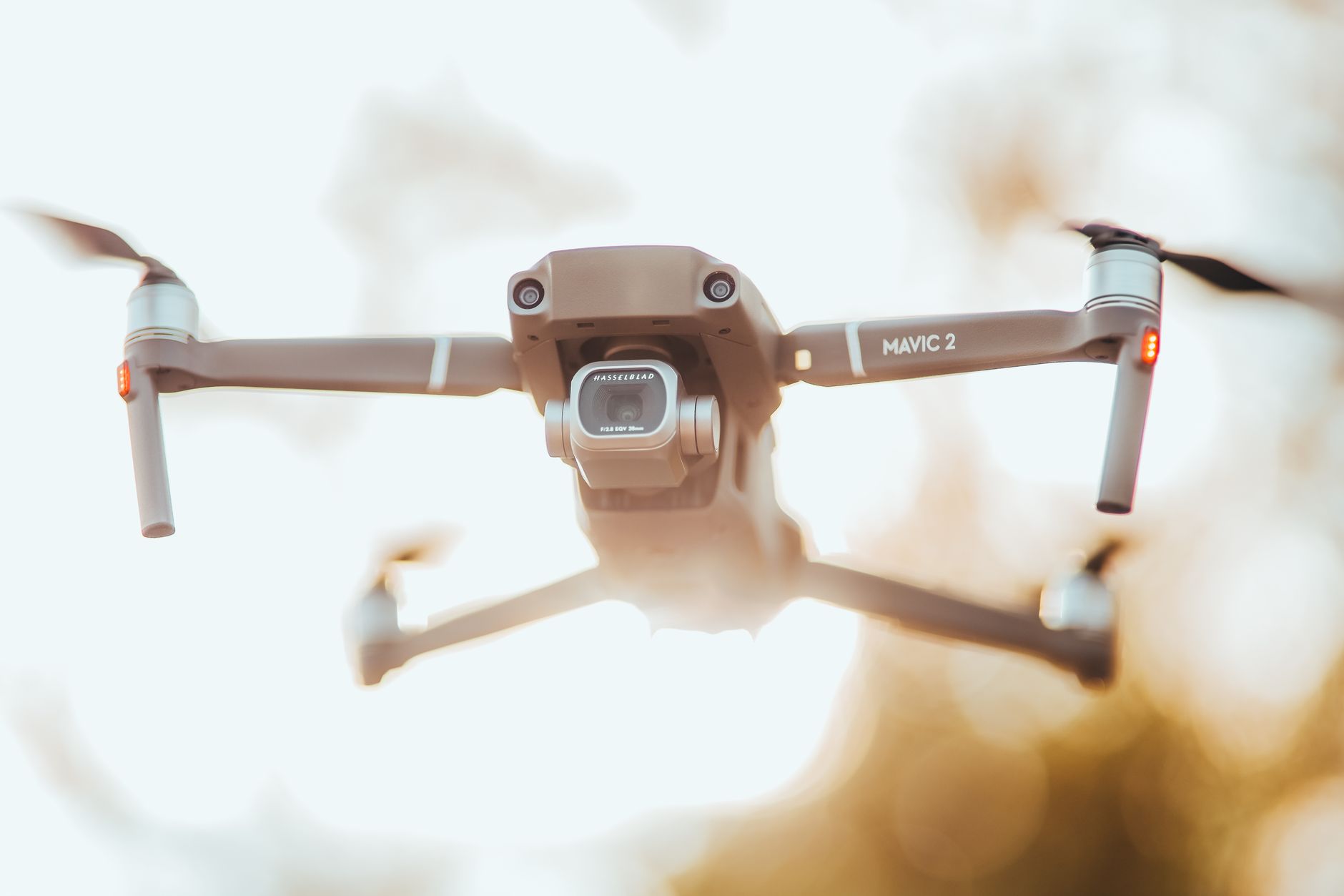 Close up of a drone camera gimbal pointing at a sunset sky